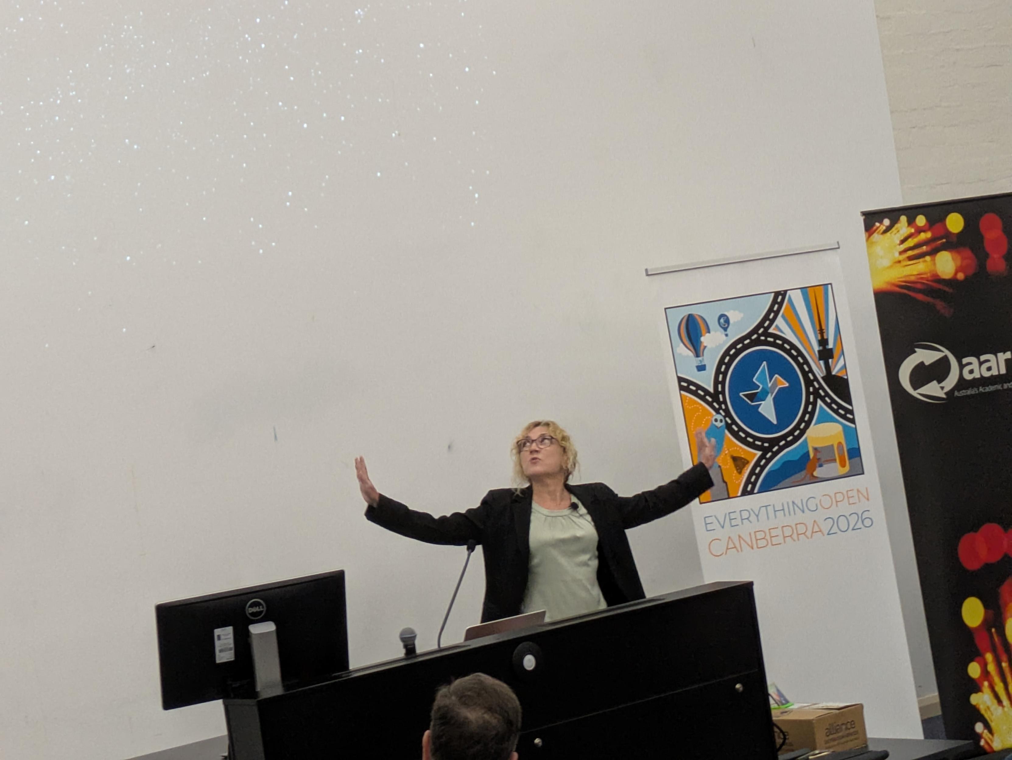 Emma Davidson introducing her talk in Ngunnawal, Auslan and English. Attribution: Kathy Reid, CC-BY-NC-SA, used with permission.